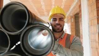vixxo-feature-portrait-of-young-man-working-in-construction-site-X8TWY39