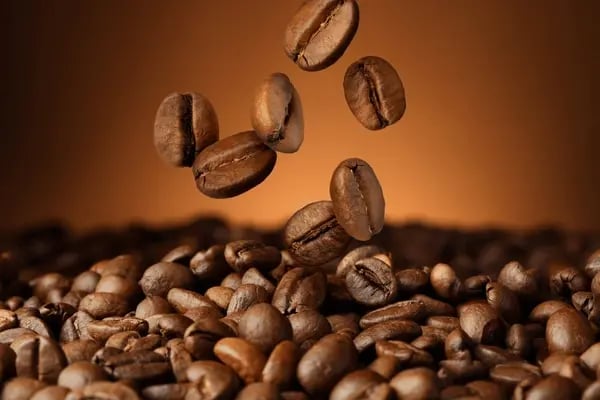roasted-coffee-beans-falling-on-600nw-2450667249